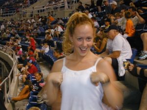 Student Jenn Rowe does the chicken dance at a Phillies baseball game.